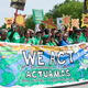 Shepard (center) marches at the People’s Climate March in 2017.